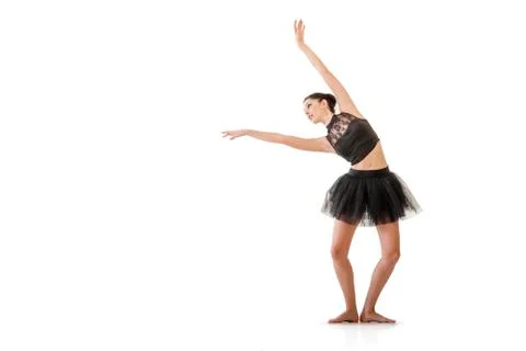 Ballerina dancing and posing in studio for a performance wearing black Foto stock