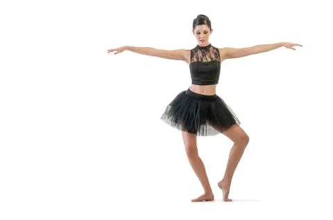 Ballerina dancing and posing in studio for a performance wearing black Foto stock
