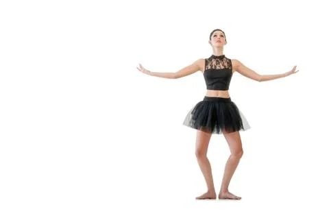 Ballerina dancing and posing in studio for a performance wearing black Stock Photos
