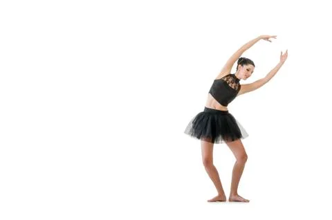 Ballerina dancing and posing in studio for a performance wearing black Stock Photos