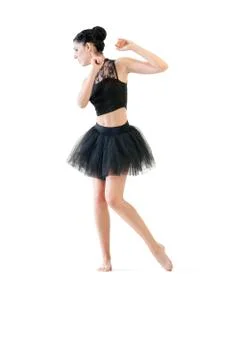 Ballerina dancing and posing in studio for a performance wearing black Stock Photos