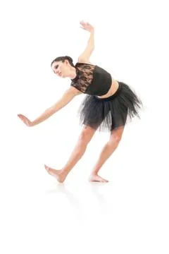 Ballerina dancing and posing in studio for a performance wearing black Stock-Fotos