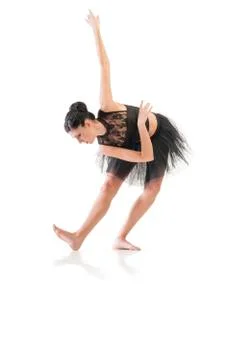 Ballerina dancing and posing in studio for a performance wearing black Stock-Fotos