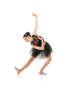 Ballerina dancing and posing in studio for a performance wearing black Stock Photos