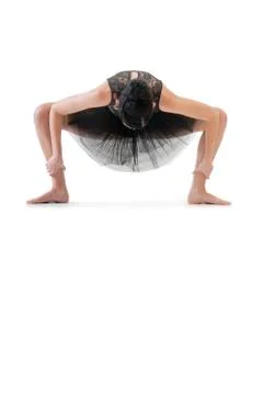 Ballerina dancing and posing in studio for a performance wearing black Stock Photos