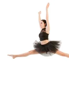 Ballerina dancing and posing in studio for a performance wearing black Stock Photos