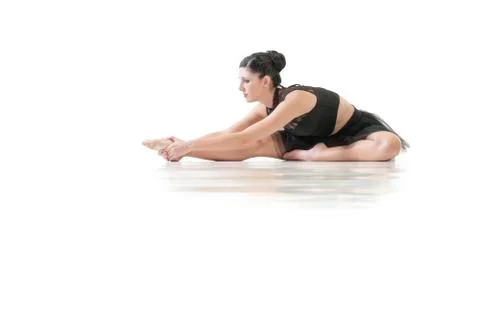 Ballerina dancing and posing in studio for a performance wearing black Foto stock