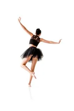 Ballerina dancing and posing in studio for a performance wearing black Foto stock