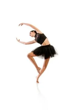 Ballerina dancing and posing in studio for a performance wearing black Stock-Fotos