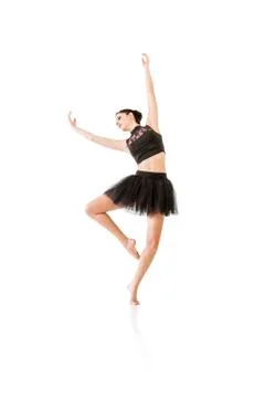 Ballerina dancing and posing in studio for a performance wearing black Stock Photos