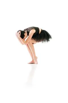 Ballerina dancing and posing in studio for a performance wearing black Stock Photos