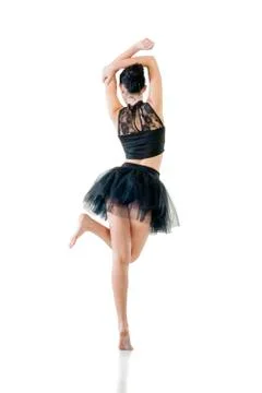 Ballerina dancing and posing in studio for a performance wearing black Stock-Fotos