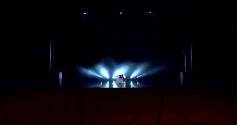 Ballerina dancing on stage in front of the auditorium Видео 149755128