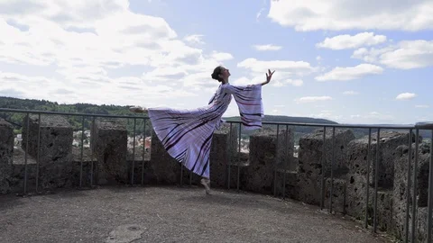 Ballerina dancing on the stage of the old castle Stock Footage 114273556