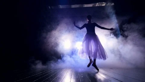 Ballerina dancing on the stage in smoke Stock Footage 76047832