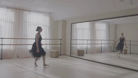 Ballerina dancing in studio in front of mirror Stock Footage 92985245