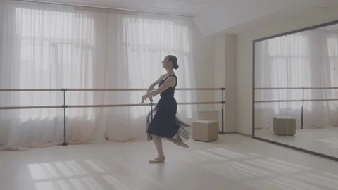 Ballerina dancing in studio in front of mirror Stock Footage 92985688