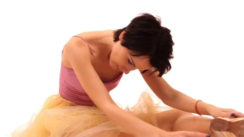 Ballerina is dancing in the studio on a white background Stock Footage 83460328