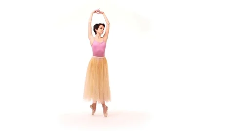 Ballerina is dancing in the studio on a white background - slow motion Stock Footage 83464562