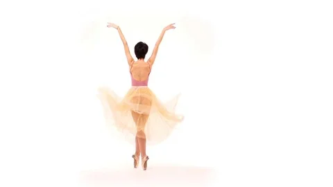 Ballerina is dancing in the studio on a white cyclorama Stock Footage 83531849