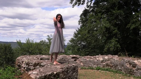 Ballerina dancing in the window of an old castle Stock Footage 113864339