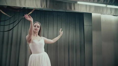 Ballerina doing a dance performing movements with her arms and body Stock Footage 155983847