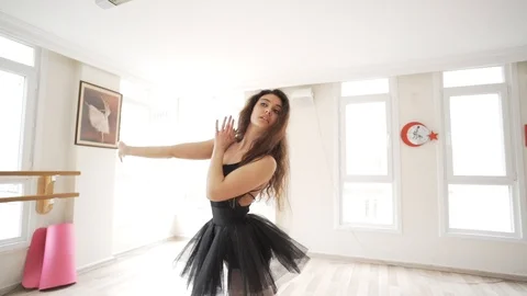 Ballerina doing practice and stretching movements in studio Video stock 104662435