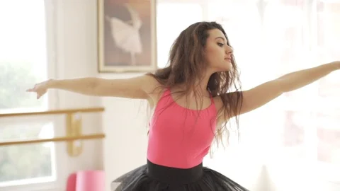 Ballerina doing practice and stretching movements in studio Stock Footage 104662928