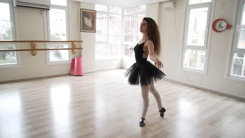 Ballerina doing practice and stretching movements in studio Video stock 104663843