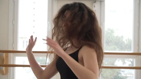 Ballerina doing practice and stretching movements in studio Stock Footage 104664977