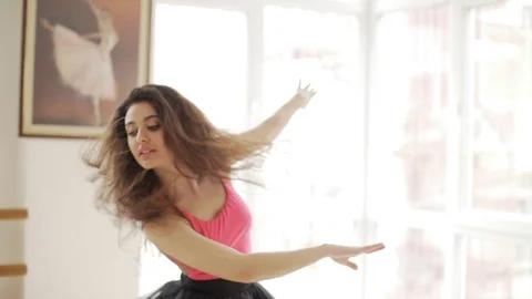 Ballerina doing practice and stretching movements in studio Stock Footage 104666127