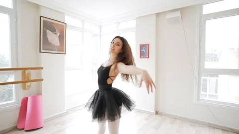 Ballerina doing practice and stretching movements in studio Video stock 104666526