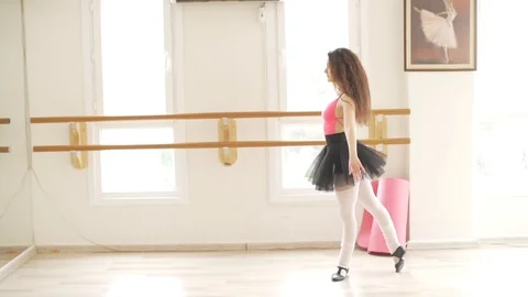Ballerina doing practice and stretching movements in studio Stock Footage 104666961