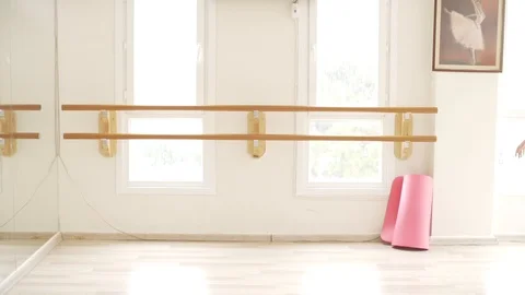 Ballerina doing practice and stretching movements in studio Stock Footage 104667583