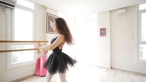 Ballerina doing practice and stretching movements in studio Video stock 104671131