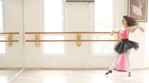 Ballerina doing practice and stretching movements in studio Video stock 104671796