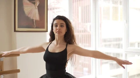 Ballerina doing practice and stretching movements in studio Video stock 104673023
