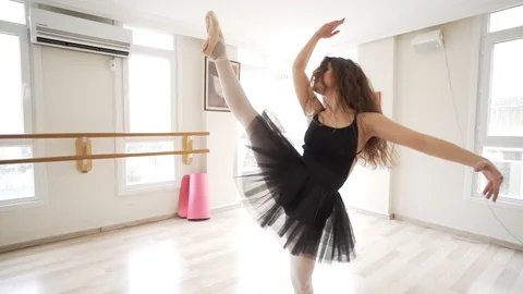 Ballerina doing practice and stretching movements in studio Stock Footage 104674440