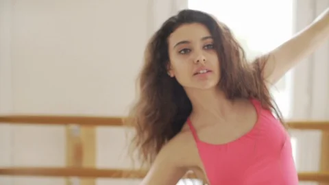 Ballerina doing practice and stretching movements in studio Stock Footage 104674741