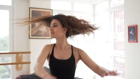 Ballerina doing practice and stretching movements in studio Stock Footage 104677739