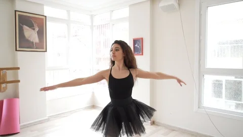 Ballerina doing practice and stretching movements in studio Video stock 104678199