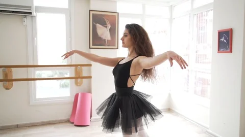 Ballerina doing practice and stretching movements in studio Video stock 104679207