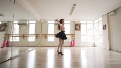 Ballerina doing practice and stretching movements in studio Stock Footage 104682192