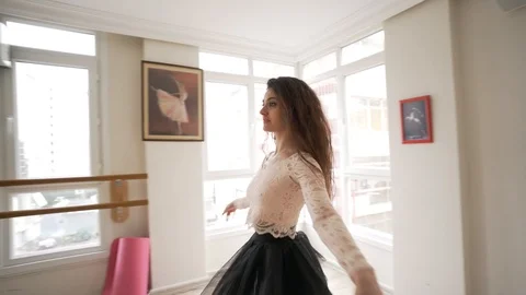 Ballerina doing practice and stretching movements in studio Video stock 104686332