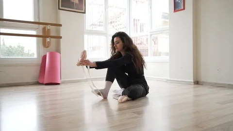 Ballerina doing practice and stretching movements in studio Video stock 104688352