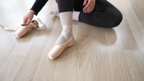 Ballerina doing practice and stretching movements in studio Stock Footage 104689705