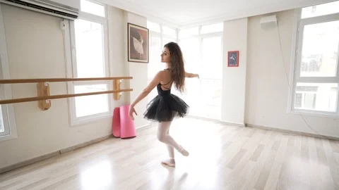 Ballerina doing practice and stretching movements in studio Stock Footage 104691378