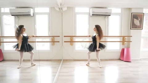 Ballerina doing practice and stretching movements in studio Stock Footage 104692135