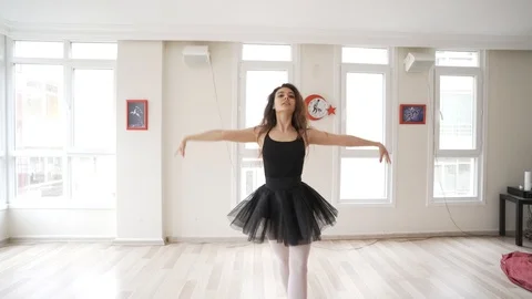Ballerina doing practice and stretching movements in studio Stock Footage 104692394