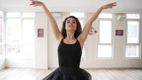 Ballerina doing practice and stretching movements in studio Stock Footage 104692582
